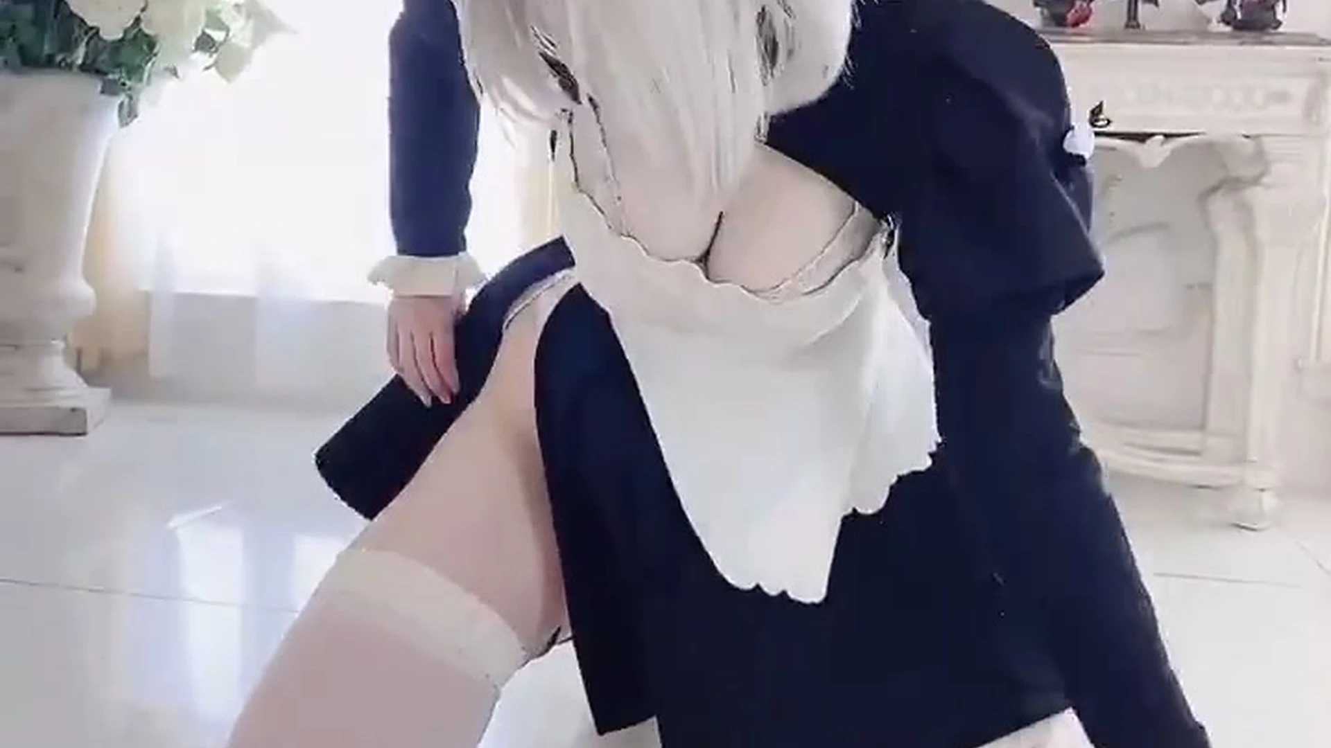 Alina Becker teasing her big tits in maid outfit