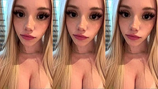 Puppiwi teasing her big tits while doing make-up