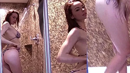 horny slut Sabrina Lynn teasing her wet bikini body in the shower