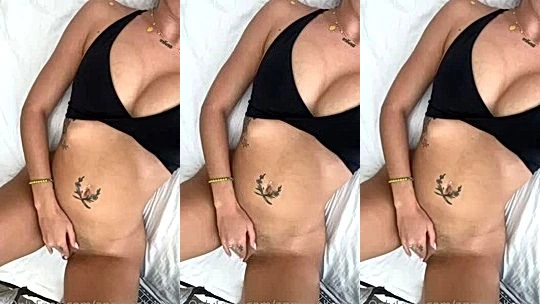 Angela Alvarez playing with her naked pussy lying in bed