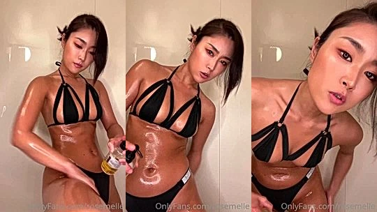 Rose Melle oiling up her sexy bikini body