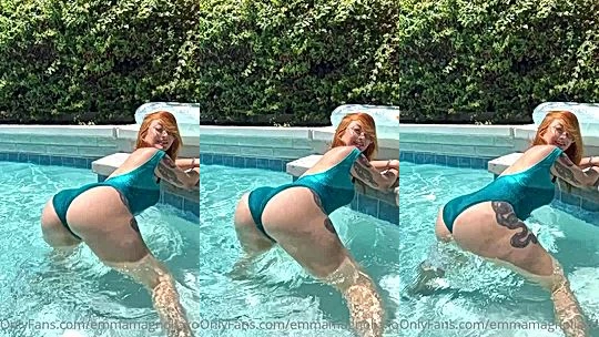 redhead Emma Magnolia showing off her big booty in the pool