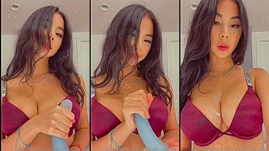 Asian.candy playing with her big tits in lingerie