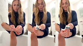 sexy model Kay Hansen moisturizing her feet