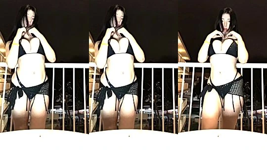 Layla Dream teasing her sexy lingerie on the balcony